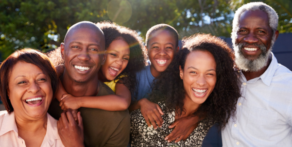 A smiling family with people of all ages
